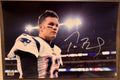 A Topps Fanatics Rookie RC auto autographed photo poster of NFL football quarterback, Tom Brady. Signed photo in silver ink marker signatures.  Photograph Tom Brady autographs for sale on 8x12 inch picture.