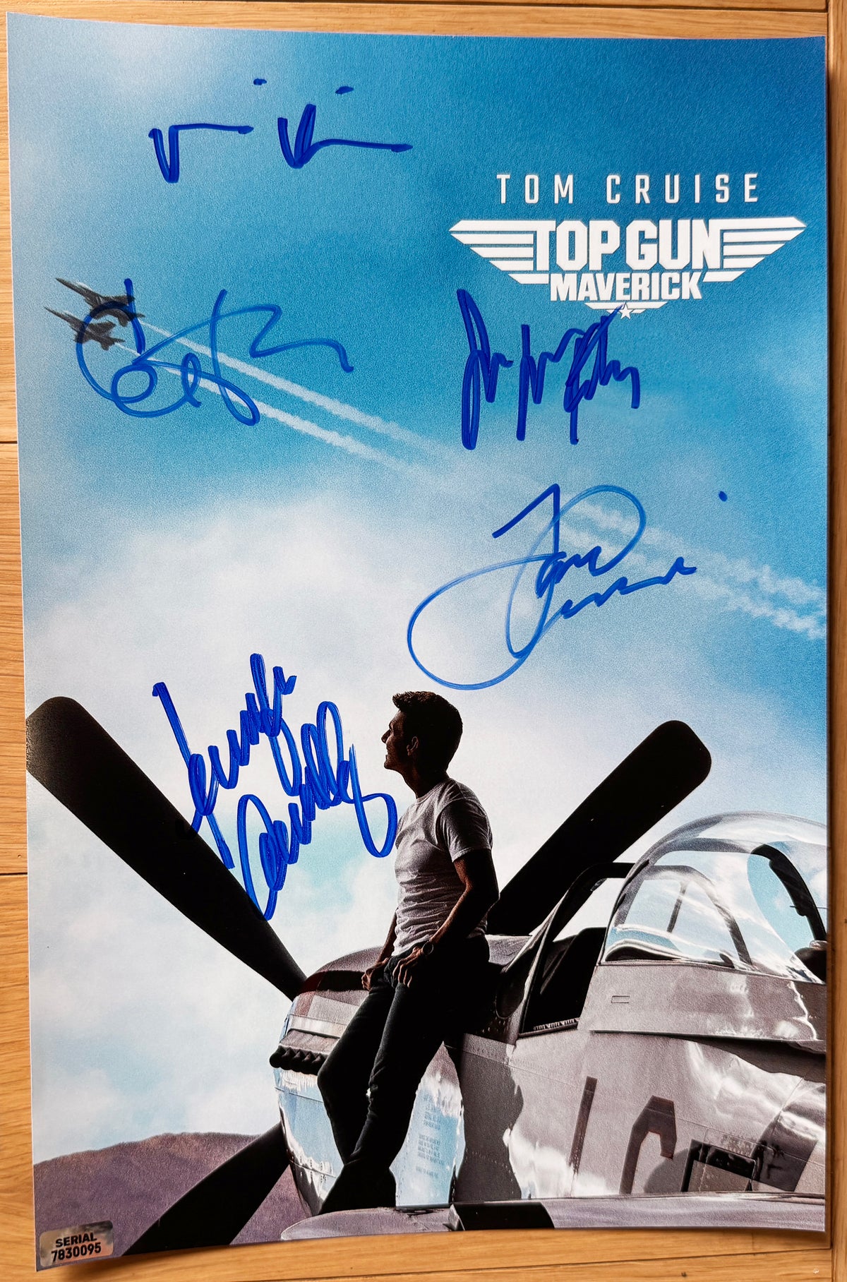 A cast autographed poster of the movie Top Gun Maverick. Signed photo of Tom Cruise, Jennifer Connelly, Val Kilmer, Jean Louisa Kelly and Ed Harris in blue ink marker signatures. Photograph autographs for sale on 8x12 inch picture.