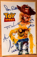 A cast autographed poster of 1995 disney pixar animated movie, Toy Story. Signed photo of Tom Hanks, Tim Allen, Don Rickles, Wallace Shawn, John Ratzenberger and Annie Potts in blue ink marker signatures. Photograph autographs for sale on 8x12 inch picture.