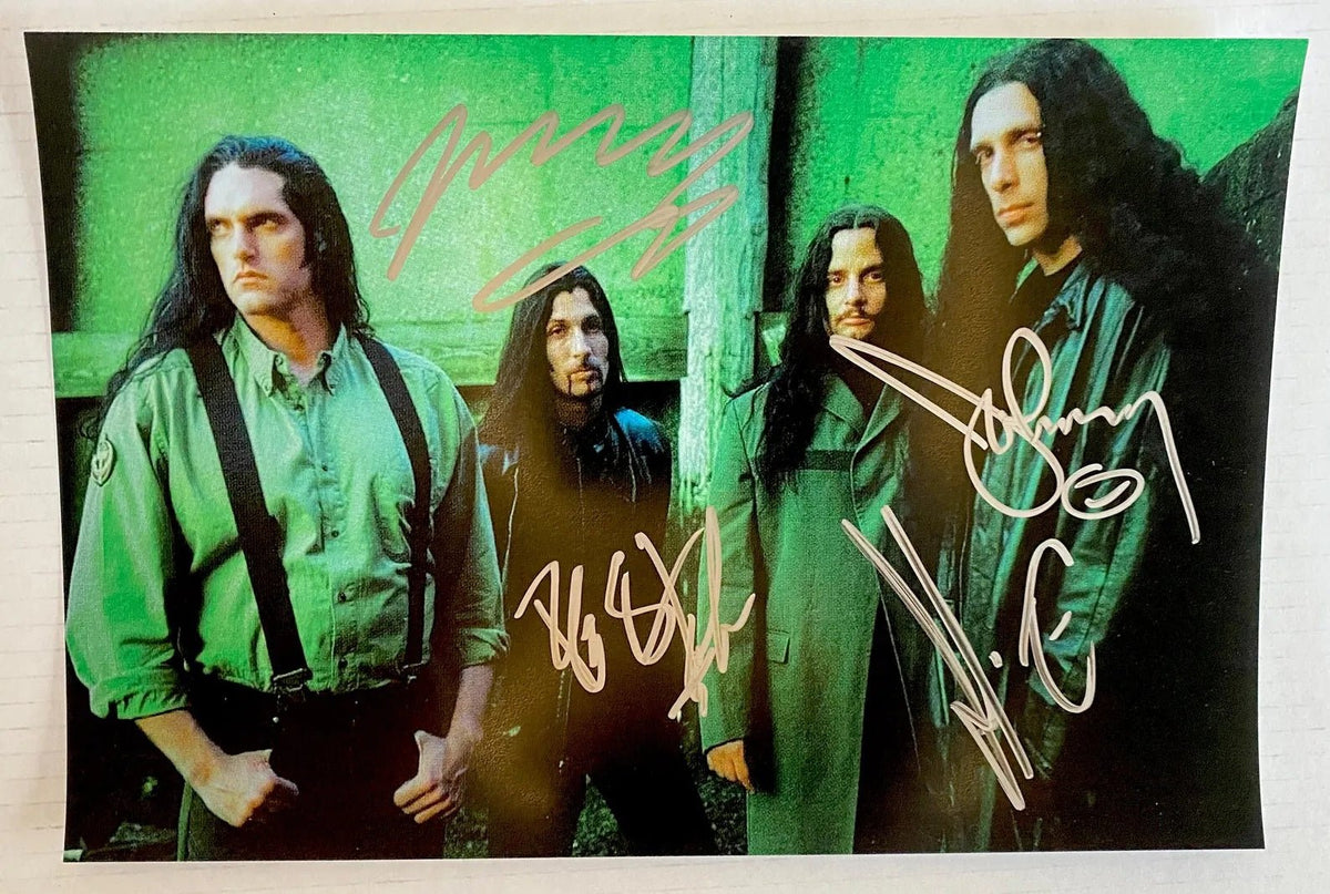 A band autographed poster of Type O Negatitve also known as Type O' Negative. Signed photo of Peter Steele, Kenny Hickey, Josh Silver and Johnny Kelly in silver ink marker signatures. Photograph autographs for sale on 8x12 inch picture.