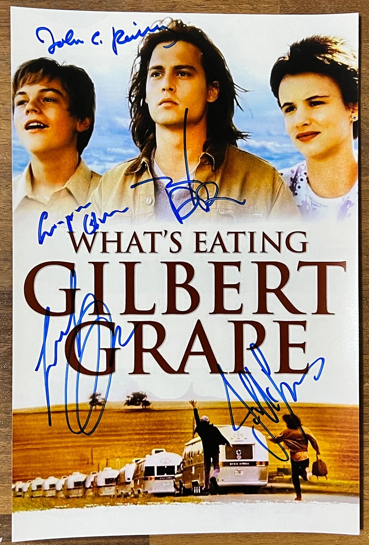 A cast autographed photo poster from the movie, What's Eating Gilbert Grape. Signed photo of Johnny Depp, Leonardo DiCaprio, Juliette Lewis, John C. Reilly and Crispin Glover in blue ink markers signatures. Photograph Johnny Depp autographs for sale on 8x12 inch picture.