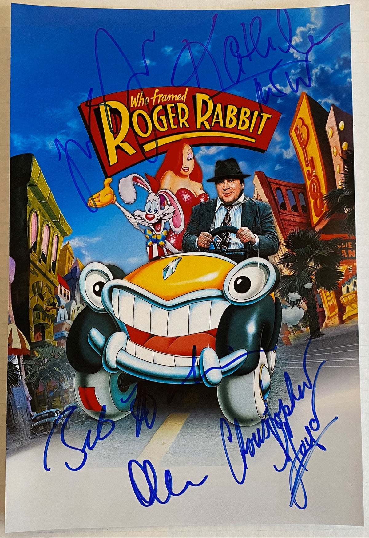 A cast autographed poster of the classic cartoon film 'Who Framed Roger Rabbit', signed photo by stars Bob Hoskins, Christopher Lloyd, Robert Zemeckis, Kathleen Turner and Charles Fleischer in blue ink markers signatures. Photograph autographs for sale on 8x12 inch picture.