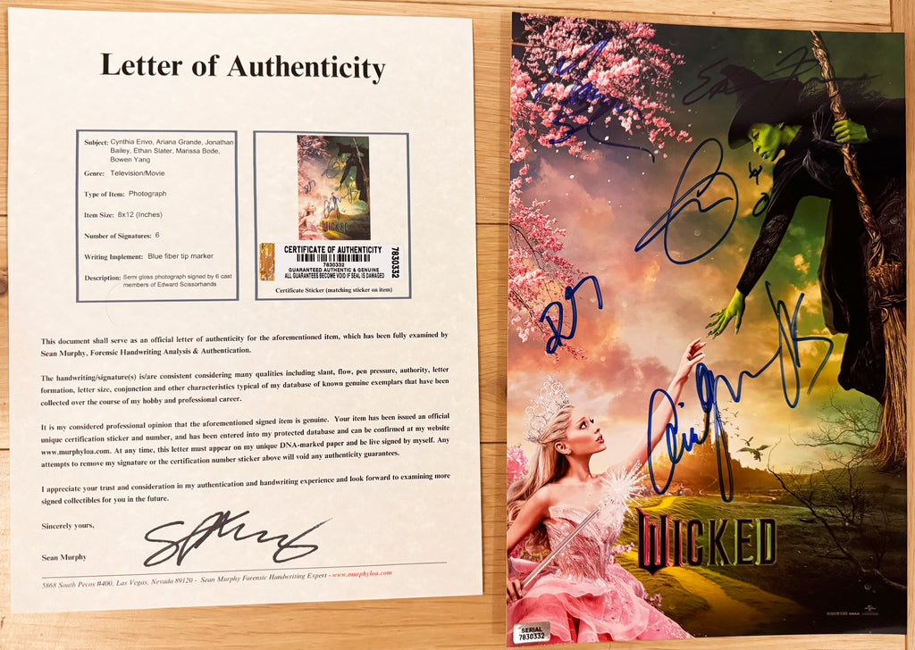 An autographed Wicked poster. Signed photo of Ariana Grande, Cynthia Erivo, Jonathan Bailey, Marissa Bode, Ethan Slater and Bowen Yang in blue ink markers. Photograph autographs for sale on 8x12 inch picture with COA.