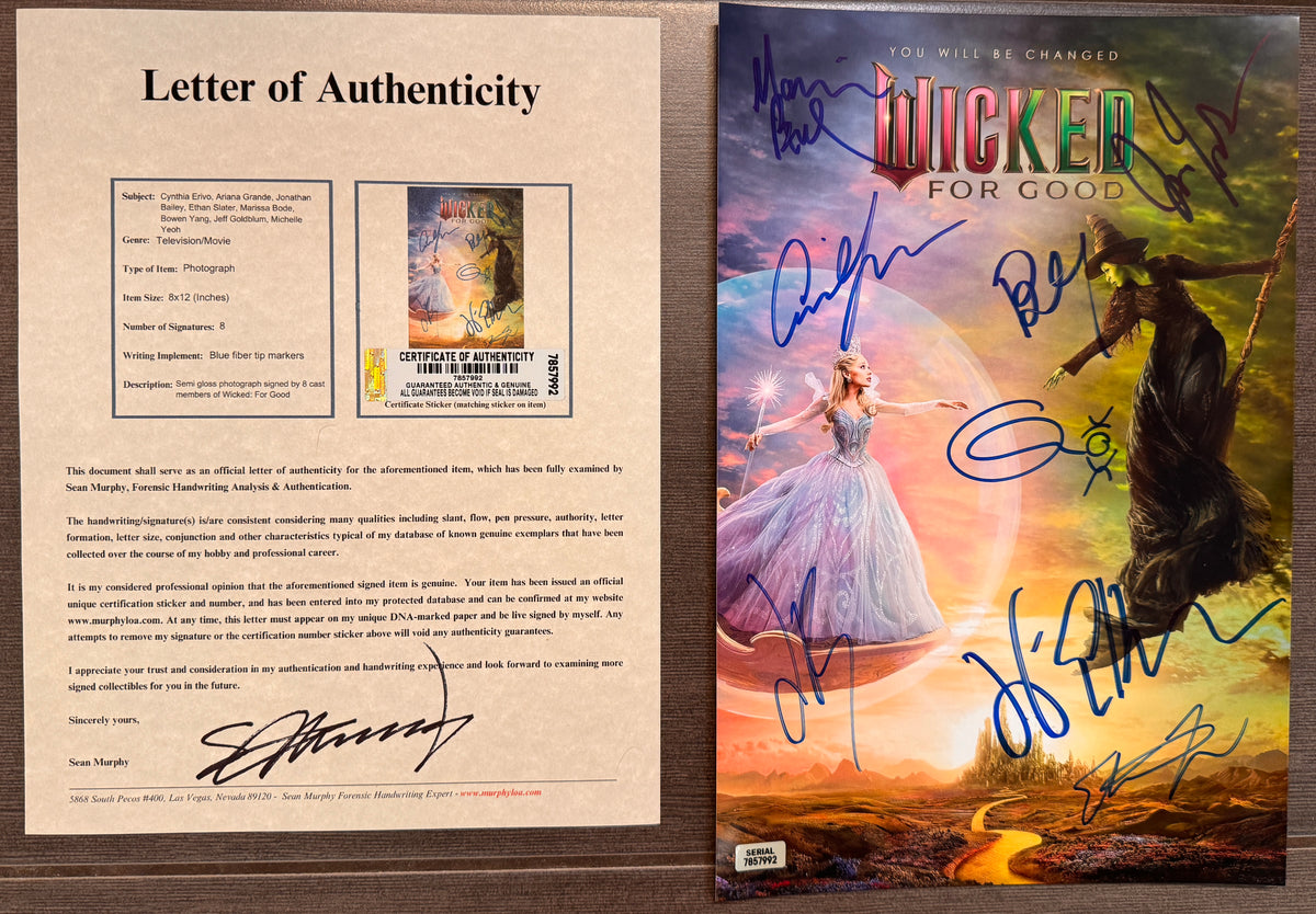 A signed and autographed 'Wicked for Good' poster featuring the Wizard of Oz and the Wicked Witch of the West, signed in blue ink autographs by Ariana Grande, Cynthia Erivo, Jonathan Bailey, Marissa Bode, Ethan Slater, Bowen Yang, Jeff Goldblum and Michelle Yeoh. autograph on 8x12 inch photograph photo autographs for sale with COA.