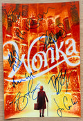 A cast autographed photo poster from the 2023 movie, WONKA. Signed photo of Timothee Chalamet, Olivia Colman, Hugh Grant, Sally Hawkins, Keegan-Michael Key, Rowan Atkinson, Matt Lucas and Jim Carter in blue ink marker signatures. Photograph autographs for sale on 8x12 inch picture.