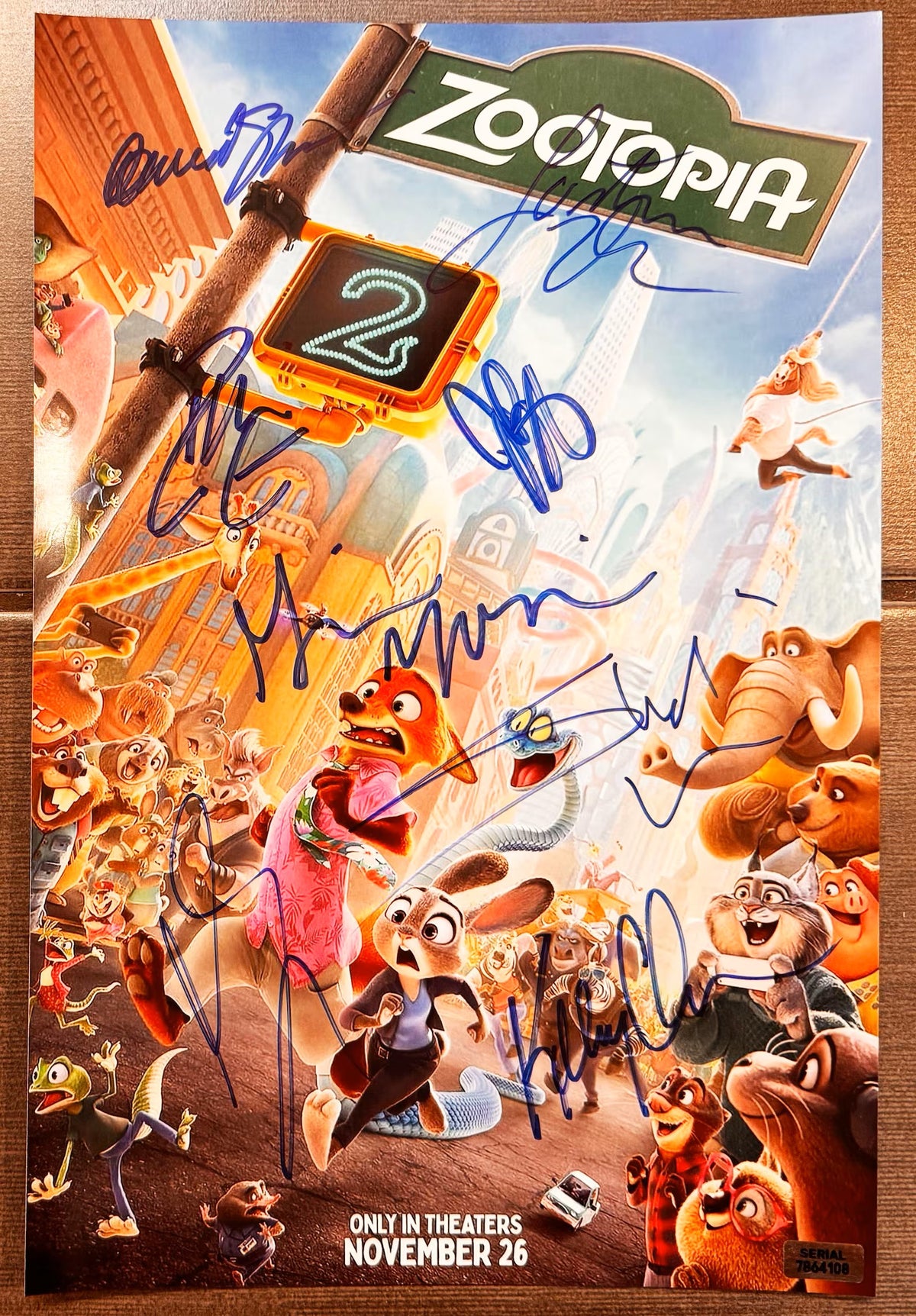 A cast signed Zootopia 2 animated movie poster. Signed photo of Ginnifer Goodwin, Jason Bateman, Ke Huy Quan, Fortune Feimster, Andy Samberg, David Strathairn, Idris Elba and Shakira in blue ink marker signatures. Photograph autographs for sale on 8x12 inch picture.
